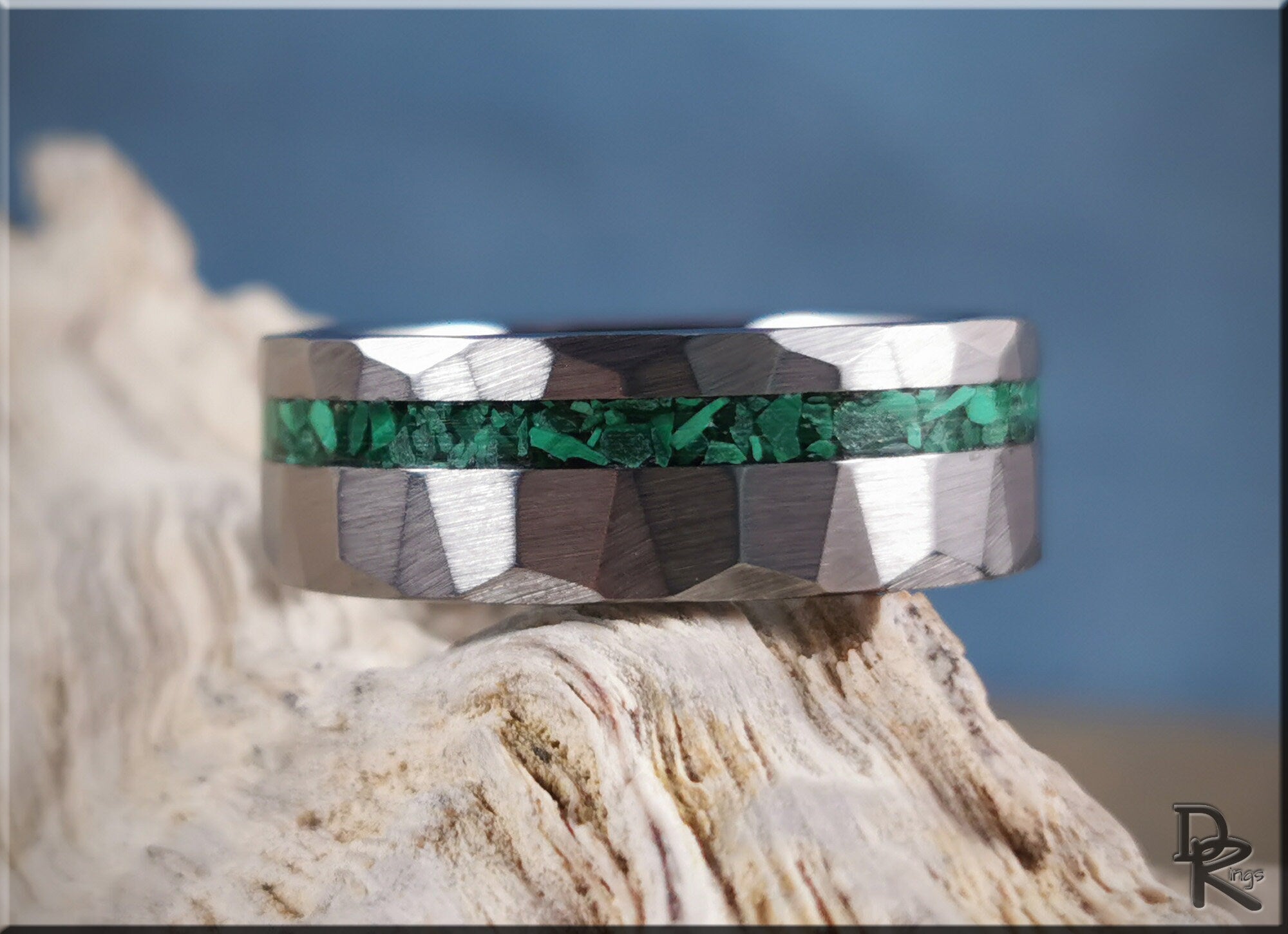 Hammered tungsten ring with malachite inlay showcasing a textured silver band with green stone detail