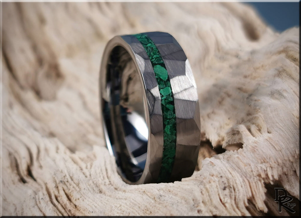 Hammered tungsten ring with malachite green stone inlay from DR Rings on textured surface