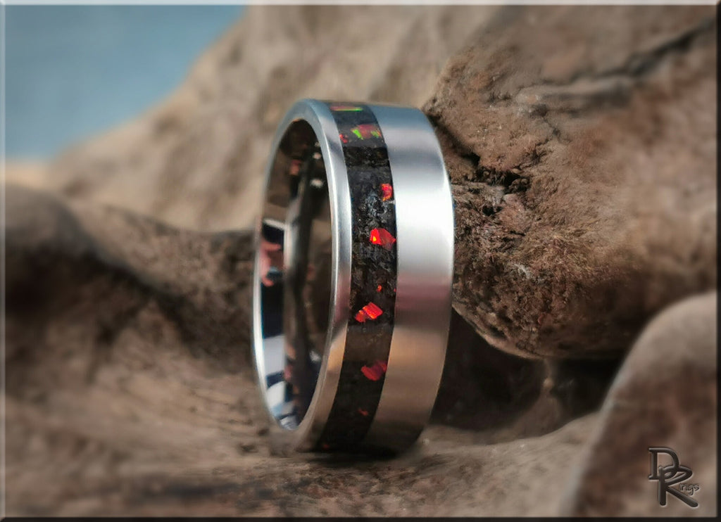 DR Rings titanium ring with inlay featuring red and green flecks on a silver band