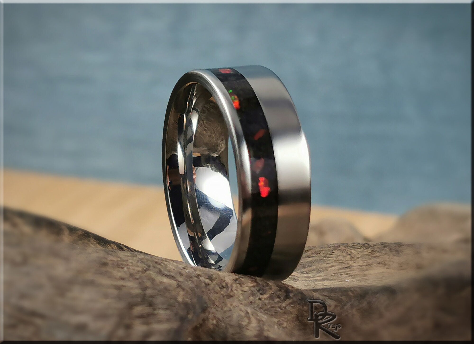 Titanium ring with inlay featuring a sleek black and red design on a polished band by DR Rings
