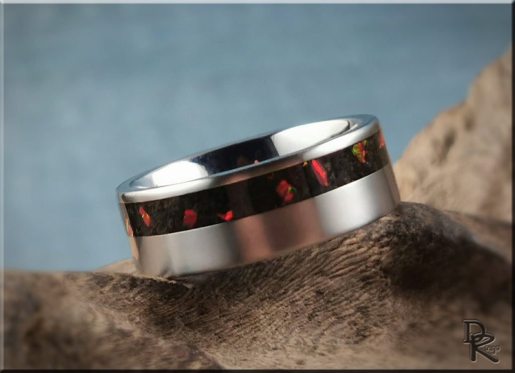 Titanium ring with inlay featuring red and black patterns, polished smooth finish by DR Rings