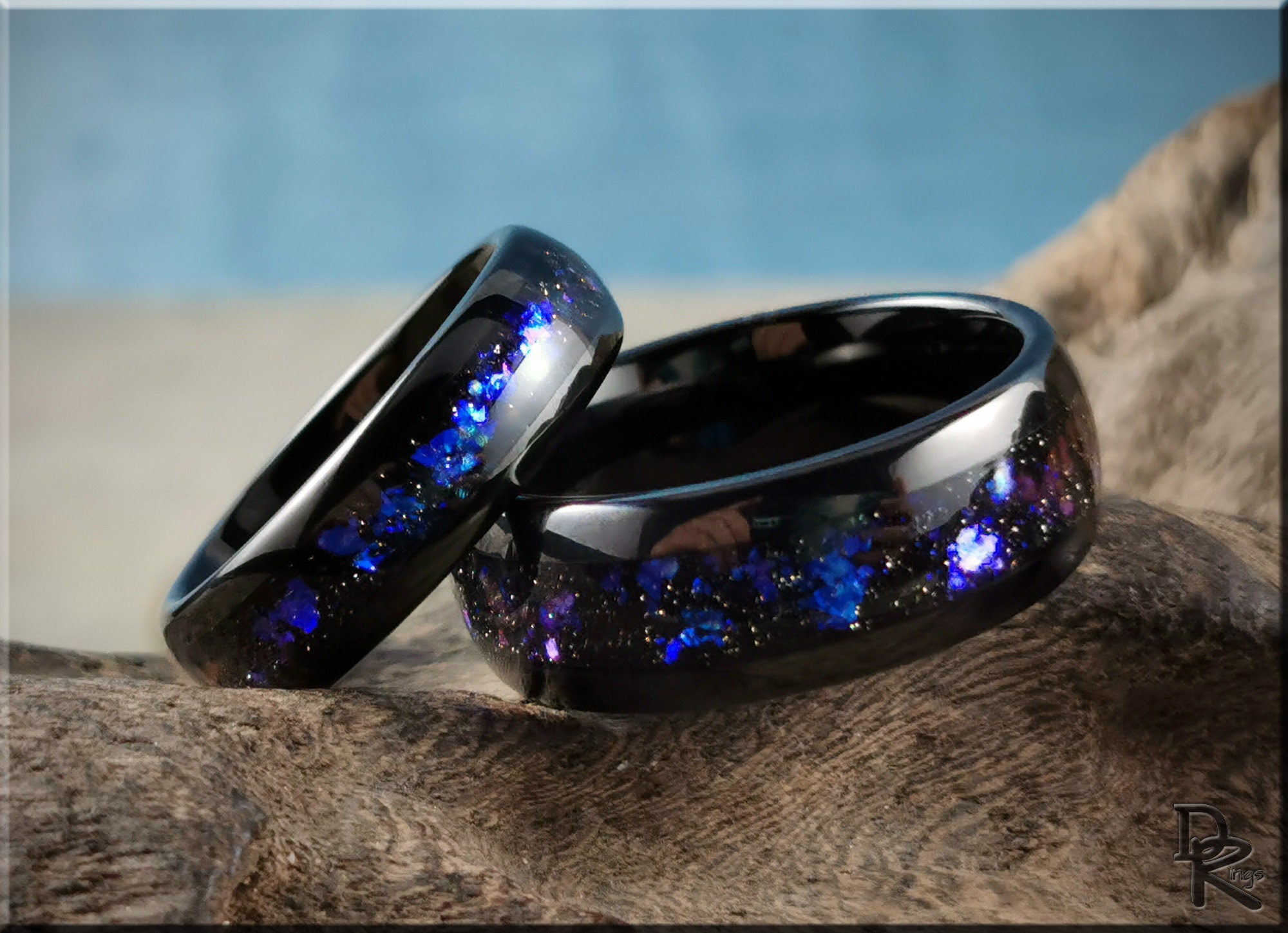 DR Rings tungsten as a ring with black finish and blue purple sparkle inlay on textured surface