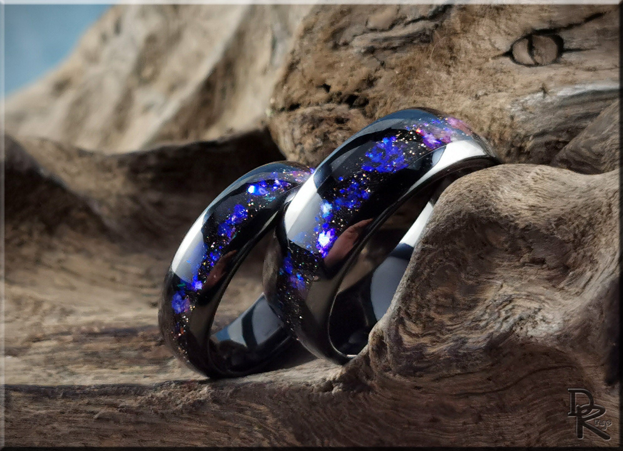 DR Rings tungsten as a ring with blue galaxy design on polished black metal bands