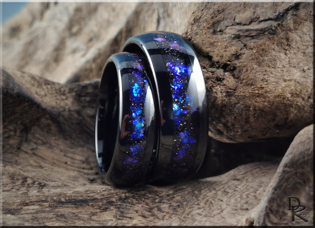 DR Rings blue and black glitter inlay tungsten as a ring set displayed on textured wood
