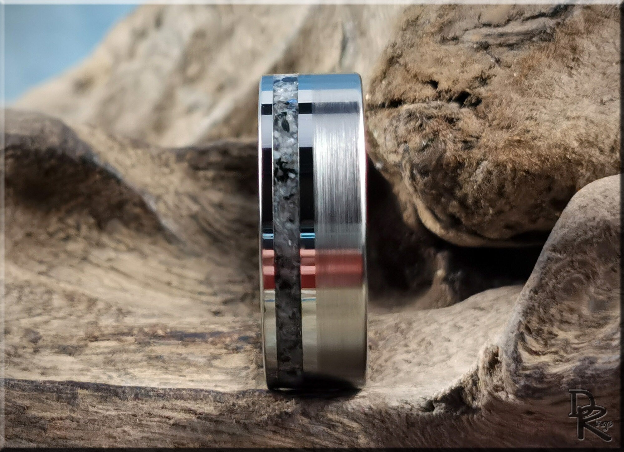 DR Rings tungsten carbide ring with moonstone inlay displayed on natural wooden surface