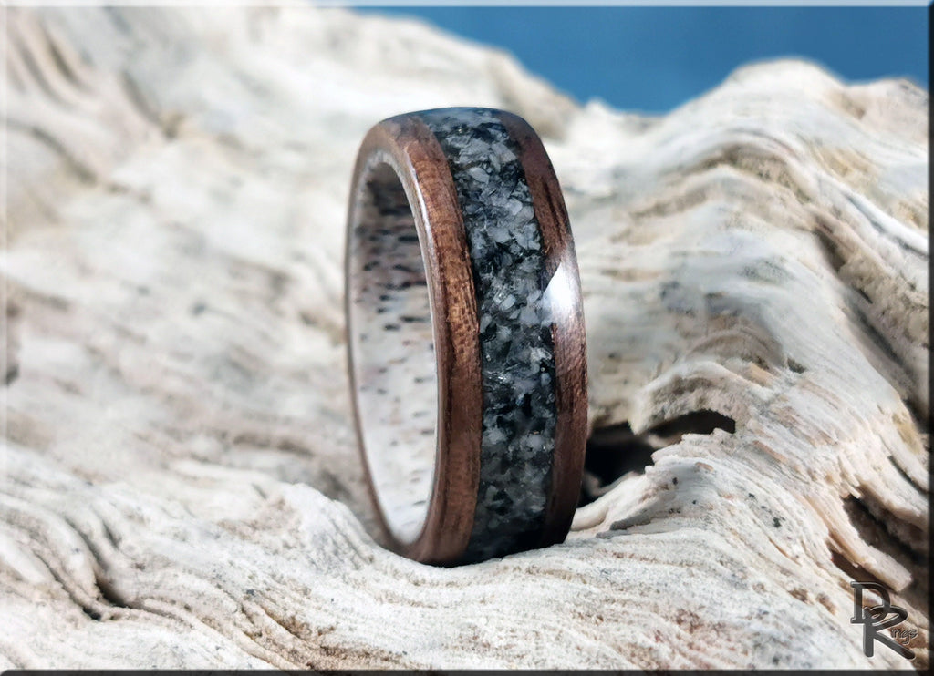 Walnut wood ring with with inlay on antler core featuring natural organic textures and polished finish