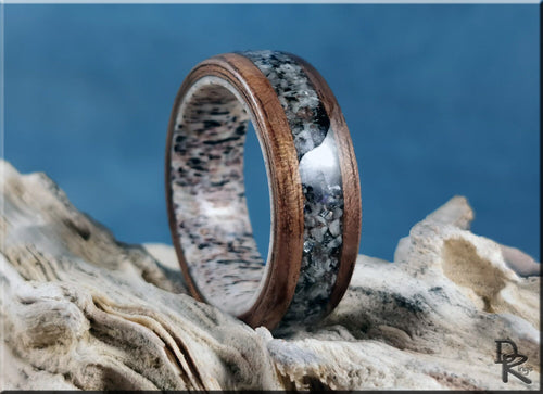 Walnut wood ring with with inlay on antler core featuring a smooth dark wood finish and unique stone inlay design