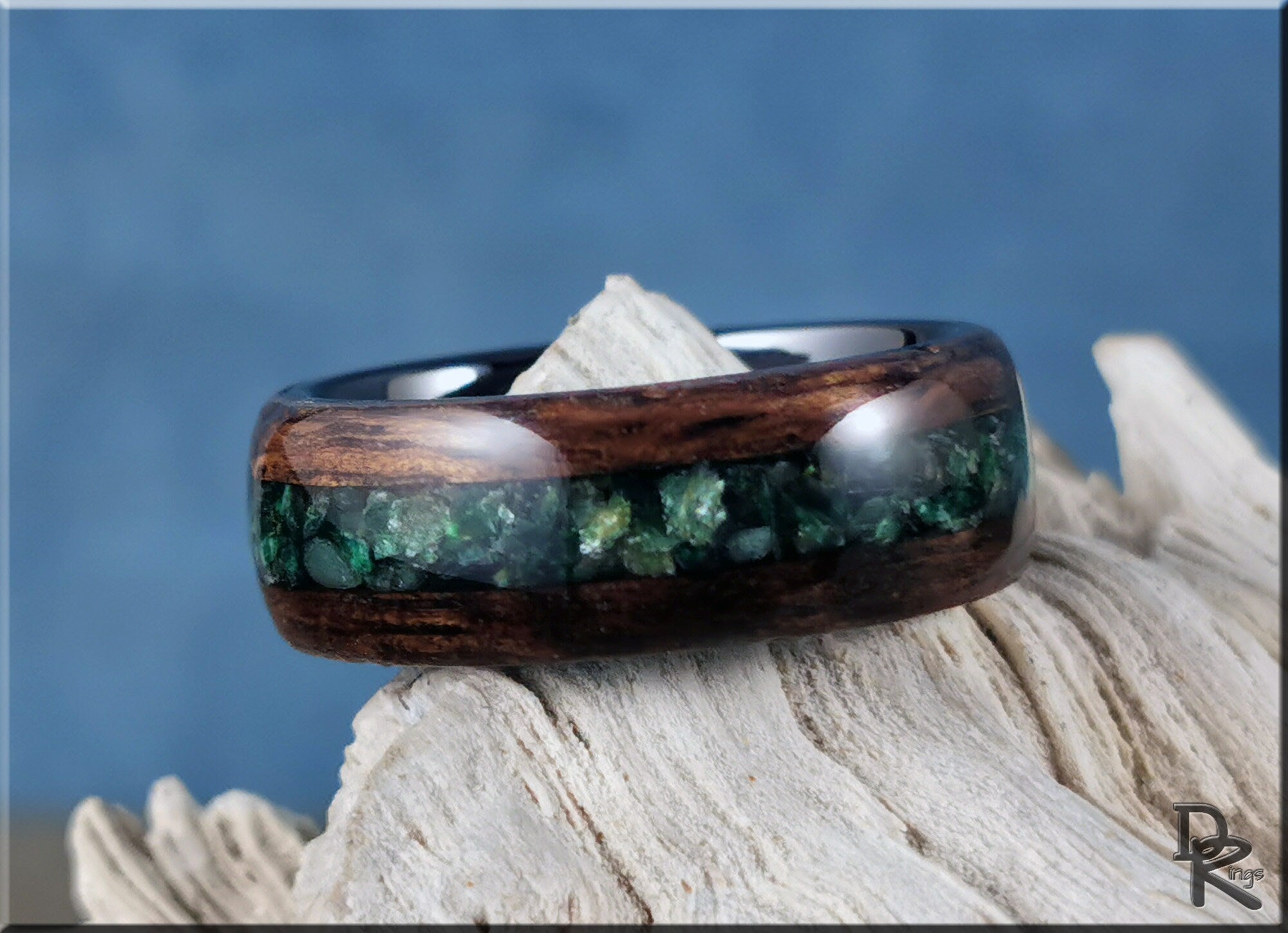 DR Rings wood ring with inlay featuring dark wood and green stone inlay on rustic background