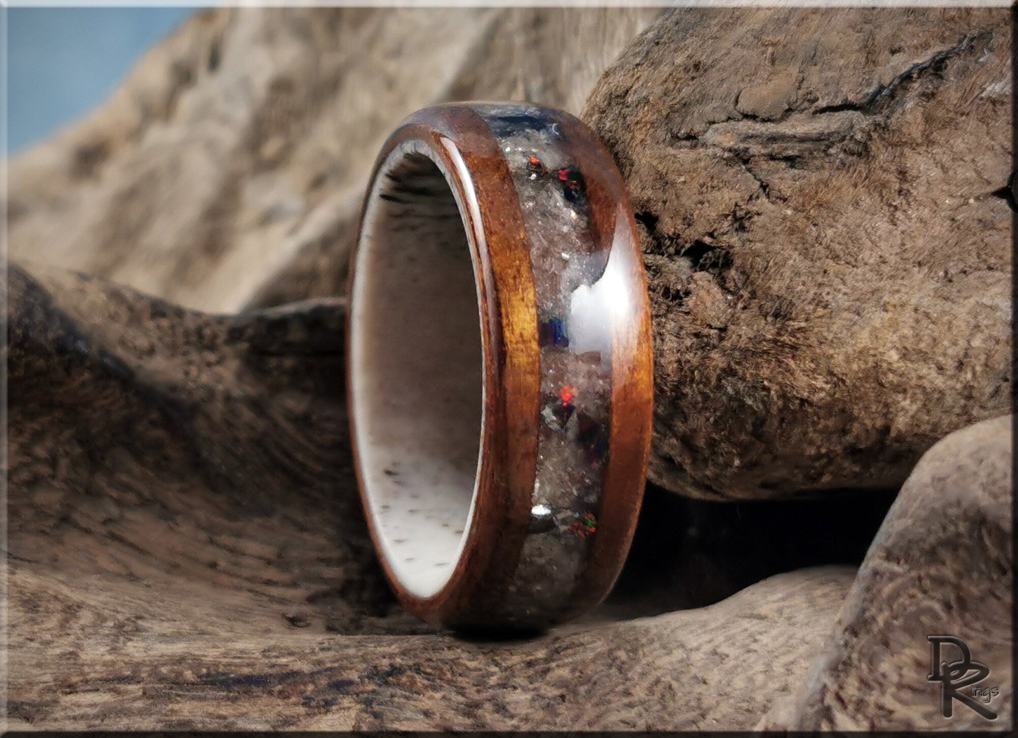 DR Rings wood ring with inlay on antler core featuring a polished wood exterior and unique natural antler inlay
