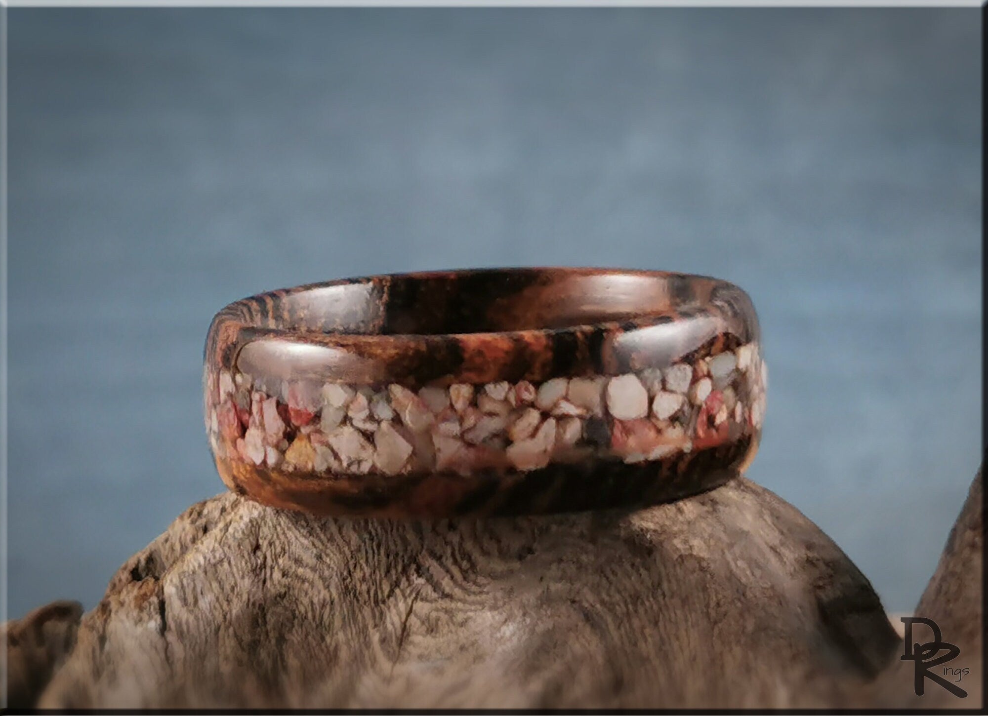 Wood ring with inlay featuring natural stone design on polished dark wood by DR Rings