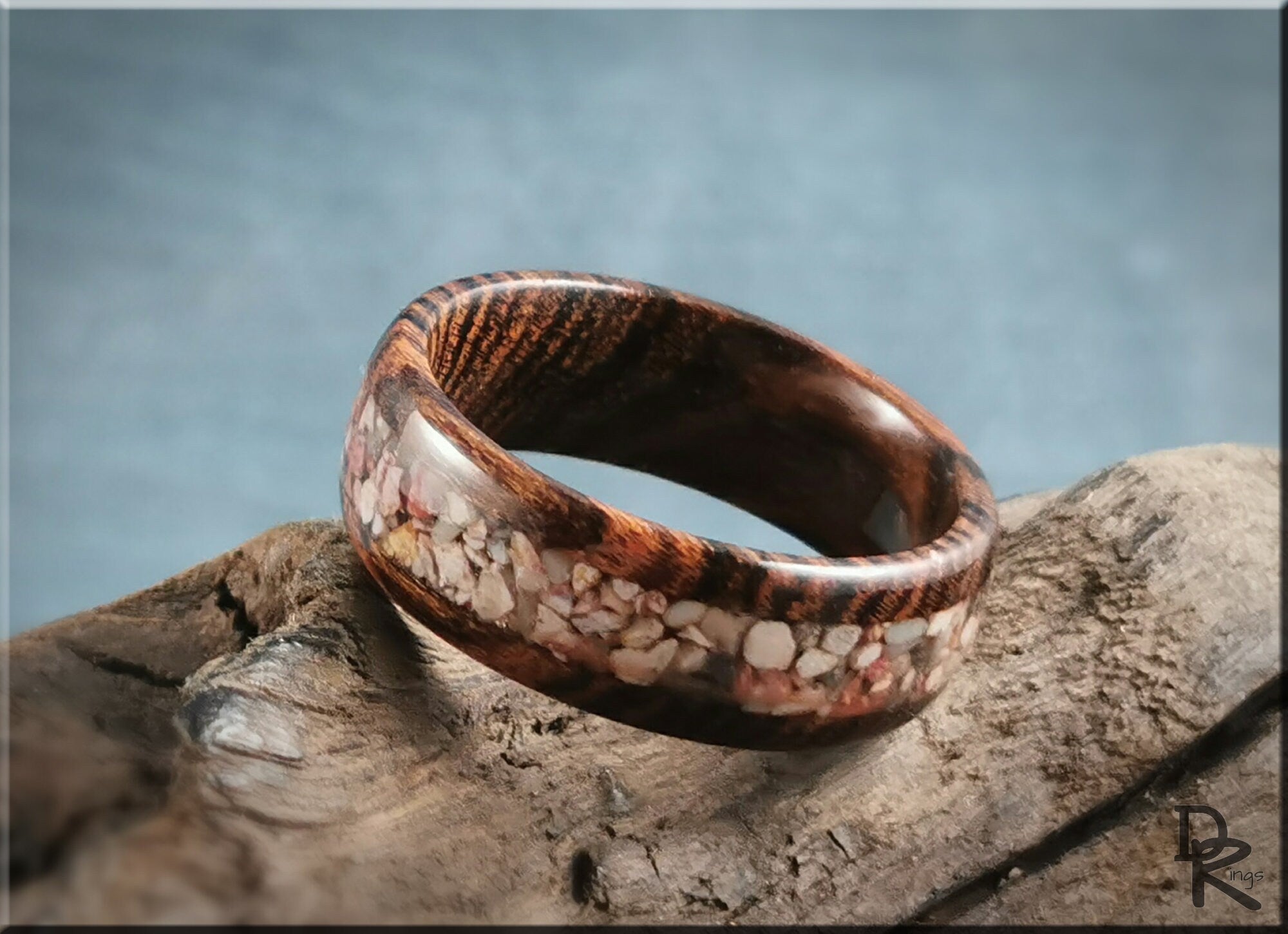 DR Rings wood ring with inlay featuring natural stone inlay on a polished wooden band