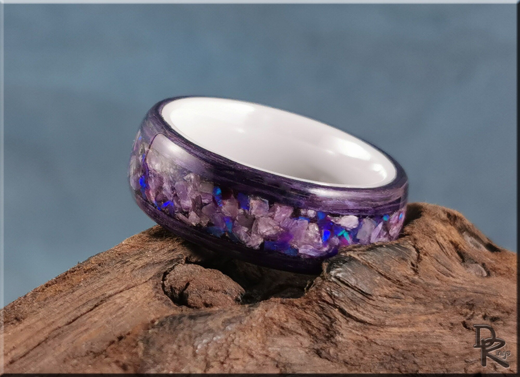 DR Rings wood ring with opal inlay featuring purple and blue tones on natural wood background